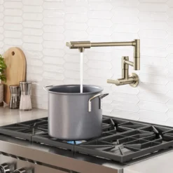 Wall Mount Pot Filler Kitchen Faucet with Retractable Arm in Spot-Free Antique Champagne Bronze