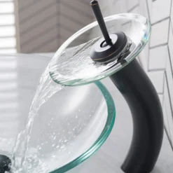 Waterfall Bathroom Faucet with Clear Glass Disk and Pop-Up Drain in Oil Rubbed Bronze