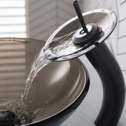 Waterfall Bathroom Faucet with Clear Brown Glass Disk and Pop-Up Drain in Oil Rubbed Bronze