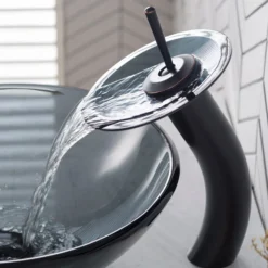 Waterfall Bathroom Faucet with Clear Black Glass Disk and Pop-Up Drain in Oil Rubbed Bronze