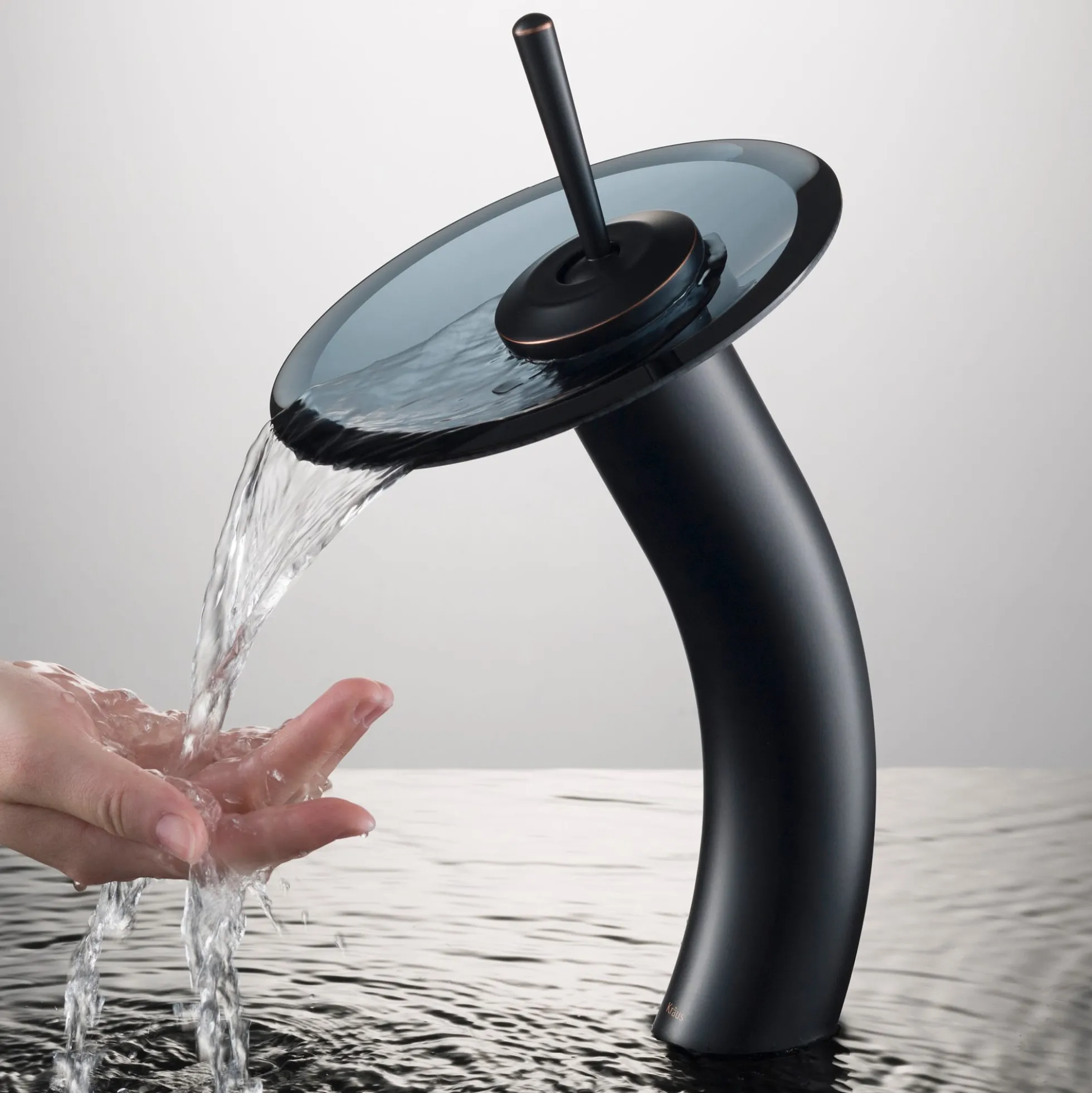 Waterfall Bathroom Faucet with Clear Black Glass Disk and Pop-Up Drain in Oil Rubbed Bronze